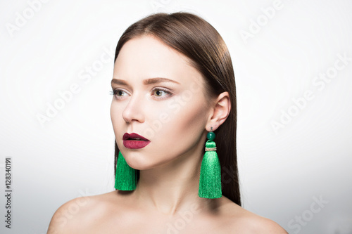 Beauty portrait of girl in Studio. With earrings