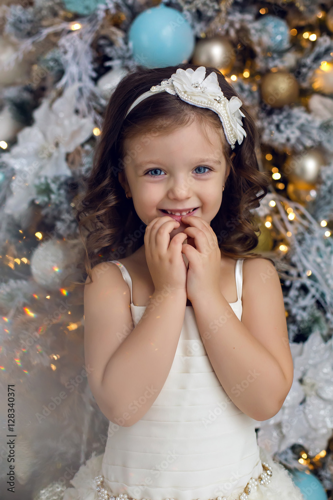 little girl three years old in a white dress smiling little girl three years old in a white dress smiling