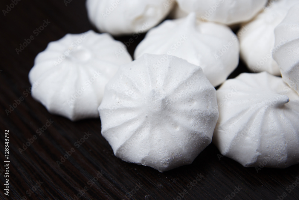 meringue on a dark table meringue on a dark table