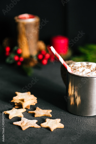 Hot cacao in hipser metal cup and cookies on black table photo