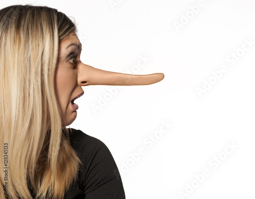 Photo upset young woman with elongated nose. concept of lying