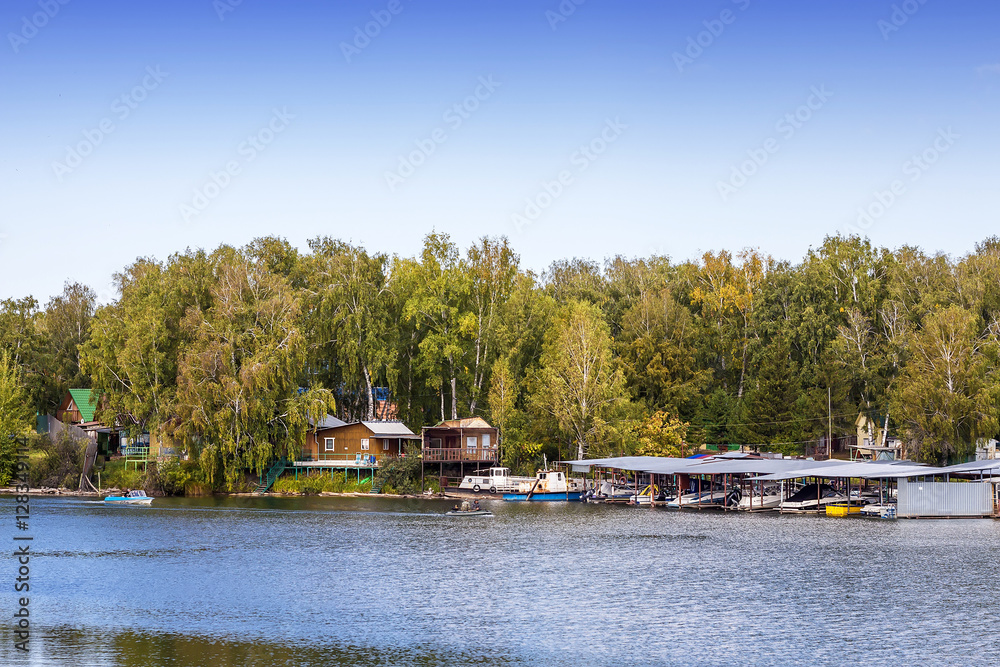 Fototapeta premium Boat station on the river on the Siberian river