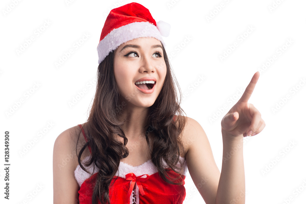 Asian beautiful woman in santa dress pointing isolated on white. Asian beautiful woman in santa dress pointing isolated on white.