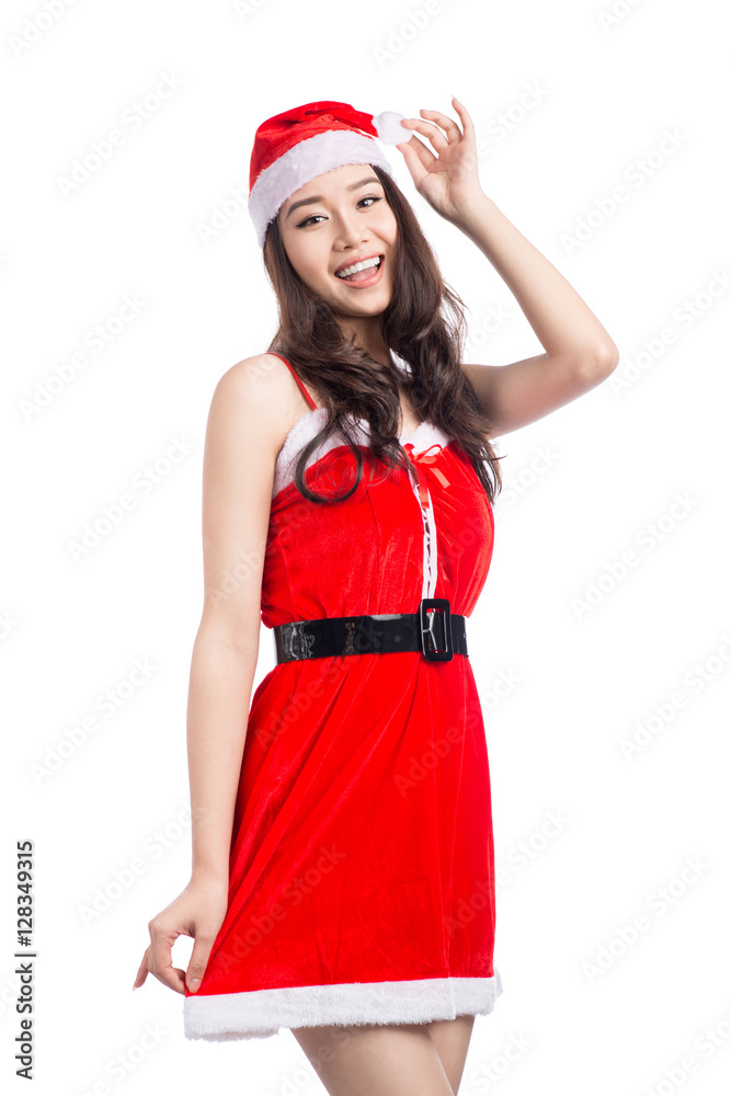 Christmas Woman. Beauty Asian Model Girl in Santa Hat isolated o Christmas Woman. Beauty Asian Model Girl in Santa Hat isolated o
