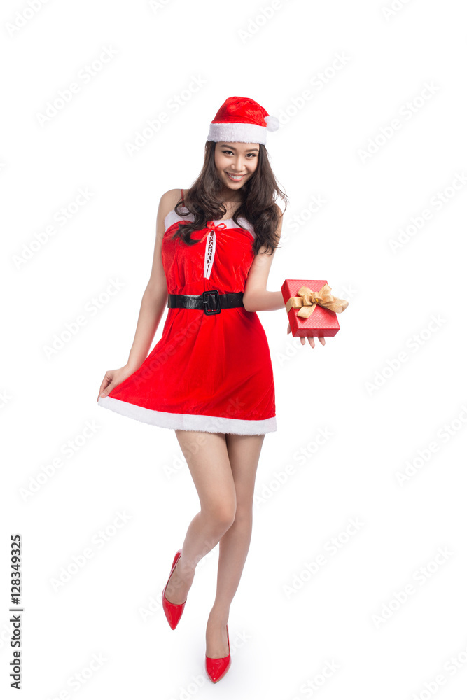 Full length portrait of a asian woman in santa claus cloth holdi Full length portrait of a asian woman in santa claus cloth holdi