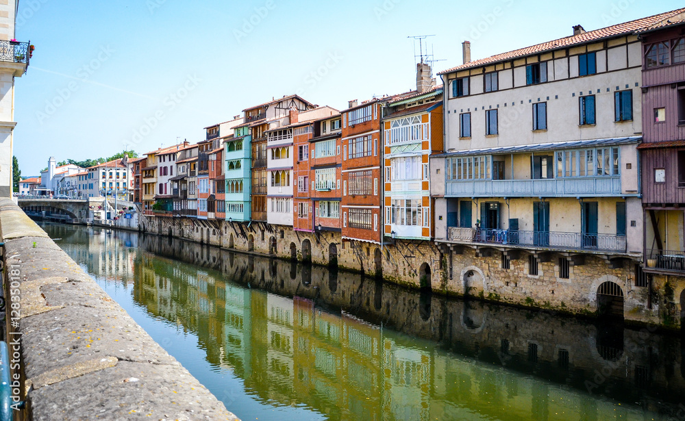 Fototapeta premium Suspended colored houses over a river in Castres-France