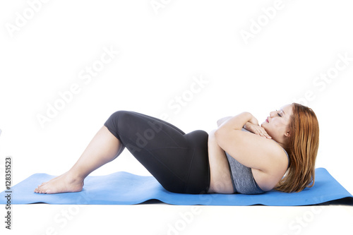 Blonde hair woman doing sit up