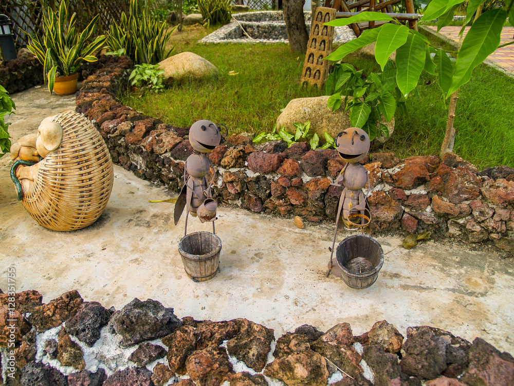 Garden decoration ants at a pathway