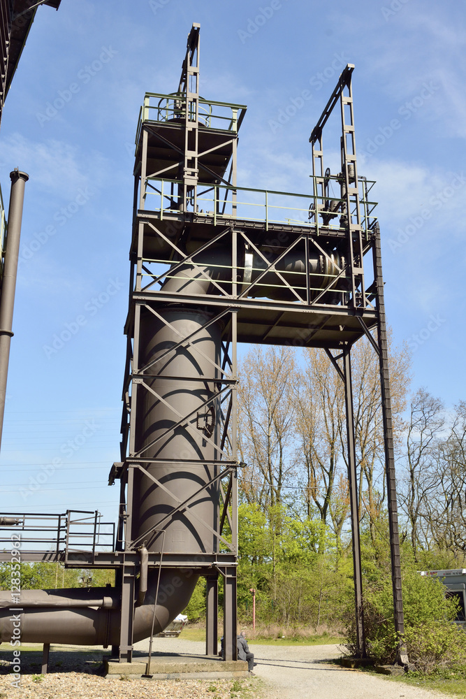 Large industrial pipe in outdoor setting. Large industrial pipe in outdoor setting.