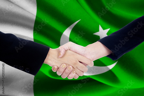 Meeting handshake with flag of Pakistan
