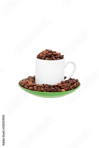 White ceramic cup filled with coffee beans