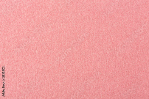 Close up detail view of a pink piece of textured felt.