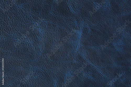 Texture of dark blue vintage leather on macro. photo