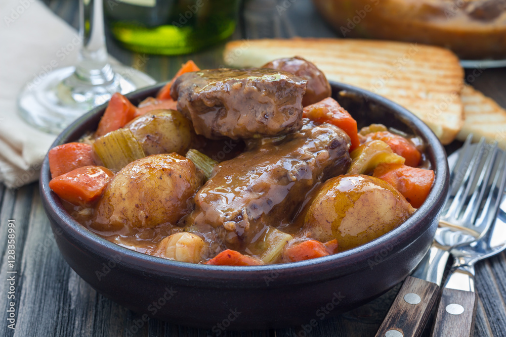 Hearty beef stew with carrot, celery, shallot and potato, horizontal Hearty beef stew with carrot, celery, shallot and potato, horizontal