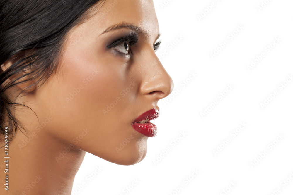profile of beautiful young woman with blue eyes on a white background profile of beautiful young woman with blue eyes on a white background