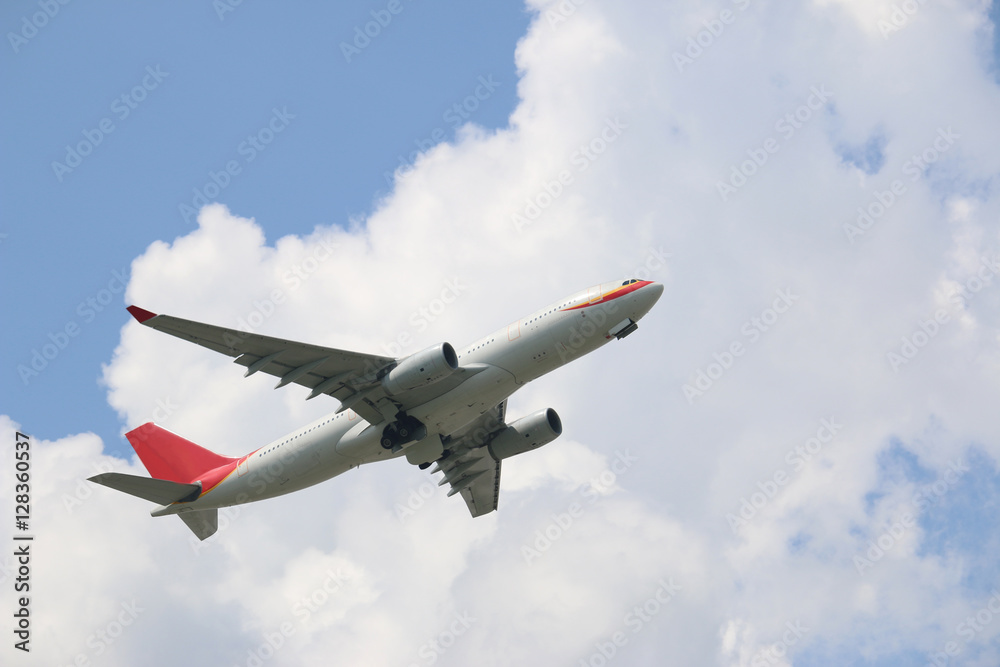 The plane was flying up the sky on a cloudy sky background. The plane was flying up the sky on a cloudy sky background.
