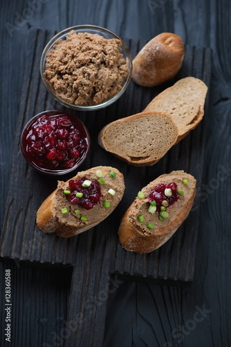 Sliced baguette, chicken liver pate and cranberry sauce