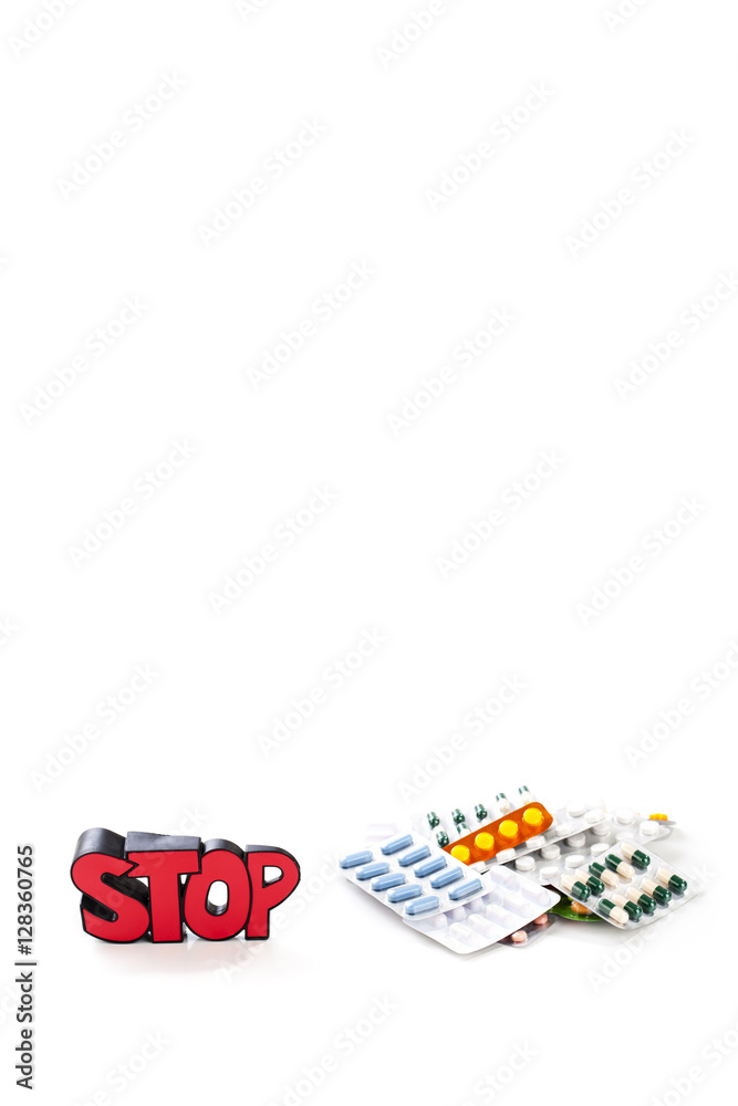 Colorful drugs and pills with sign STOP Colorful drugs and pills with sign STOP