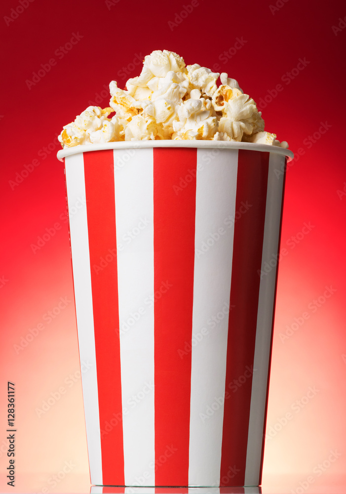 Striped box with popcorn on a red