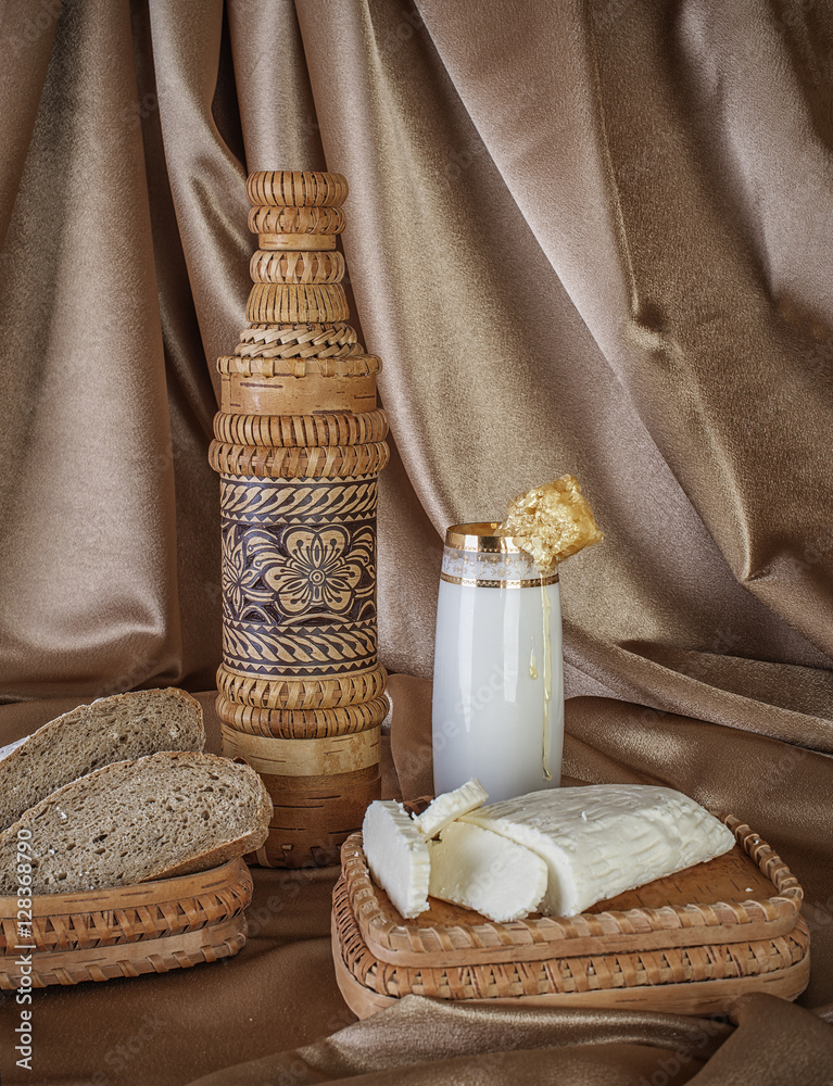 organic milk in glass honey, almonds and goat cheese