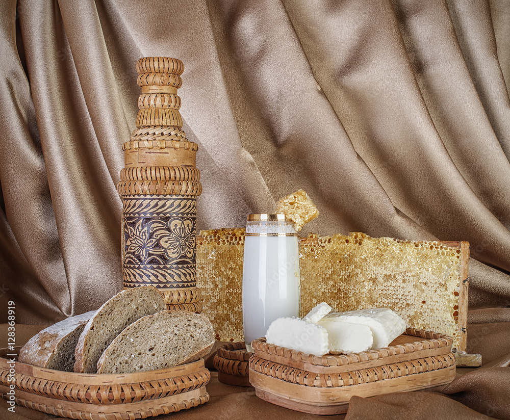 organic milk in glass honey, almonds, goat cheese and honeycomb