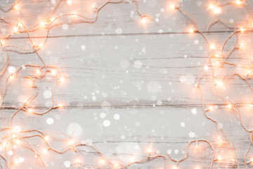 Christmas lights wooden background