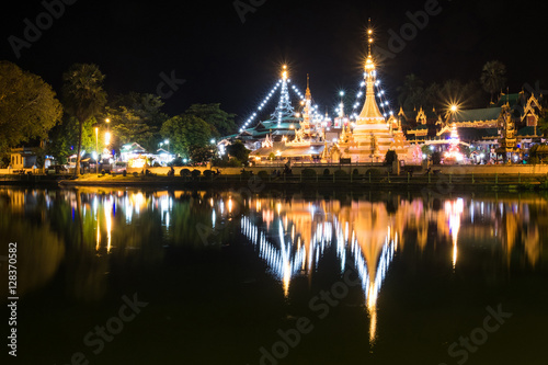 Temple light up at night with reflection