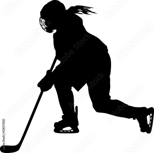 Female hockey player skating with stick
