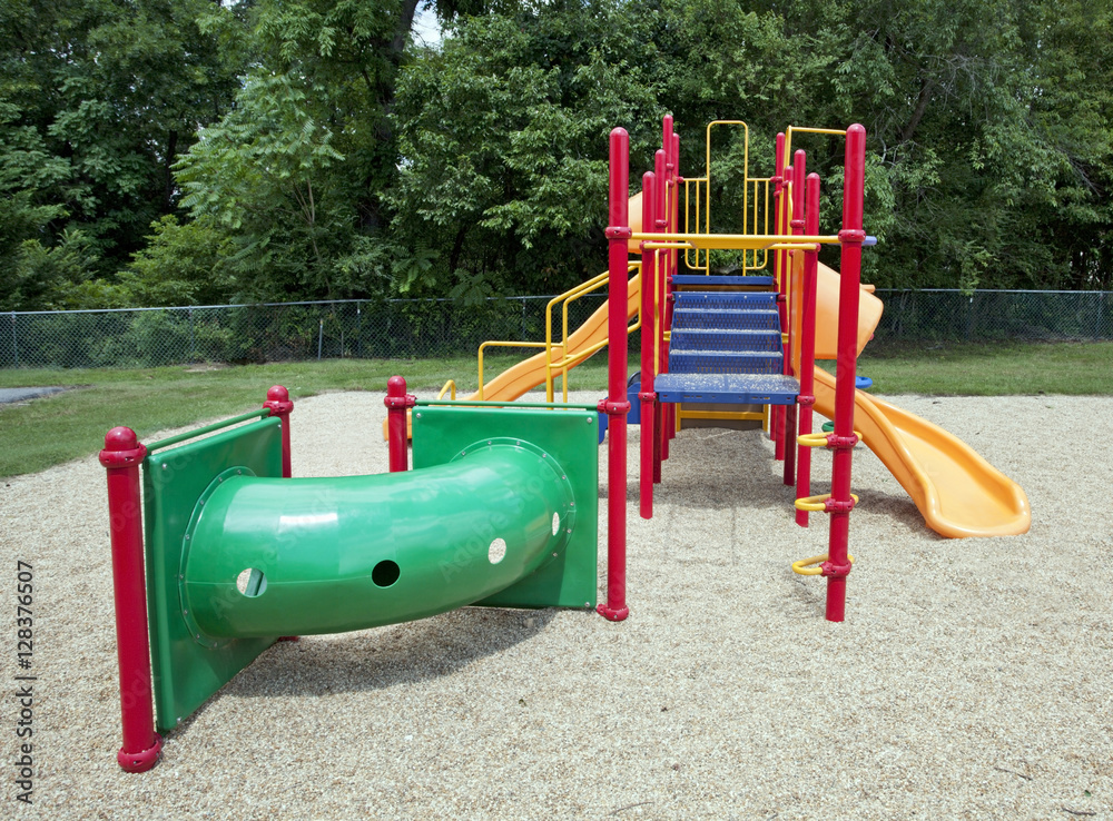 Empty children's playground with tree background. Horizontal.