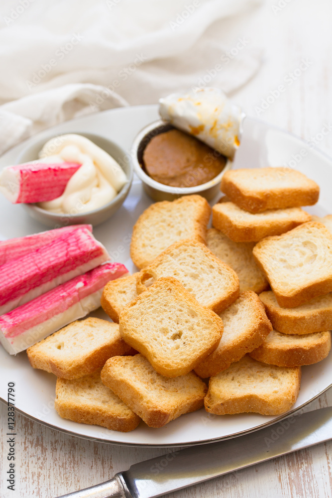snack on white plate on wooden background snack on white plate on wooden background