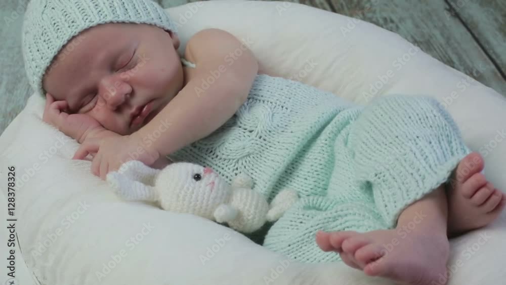 A baby boy asleep. A baby boy asleep.