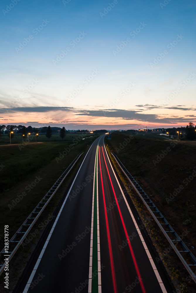 Long exposure photo of traffic on the move at dusk..