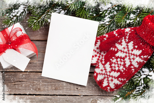 Christmas greeting card, fir tree, mittens and gift