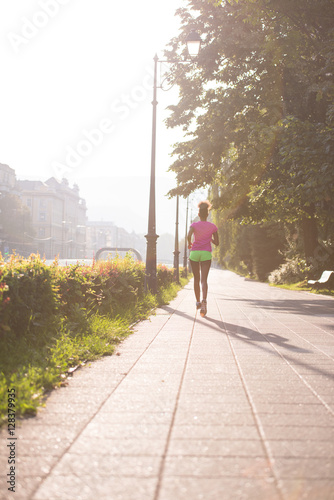 african american woman jogging in the city