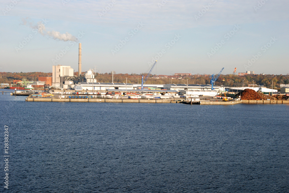 industrial plant by the harbor, ship yard and construction site by the shipping port, bulk carrier receiving terminal
