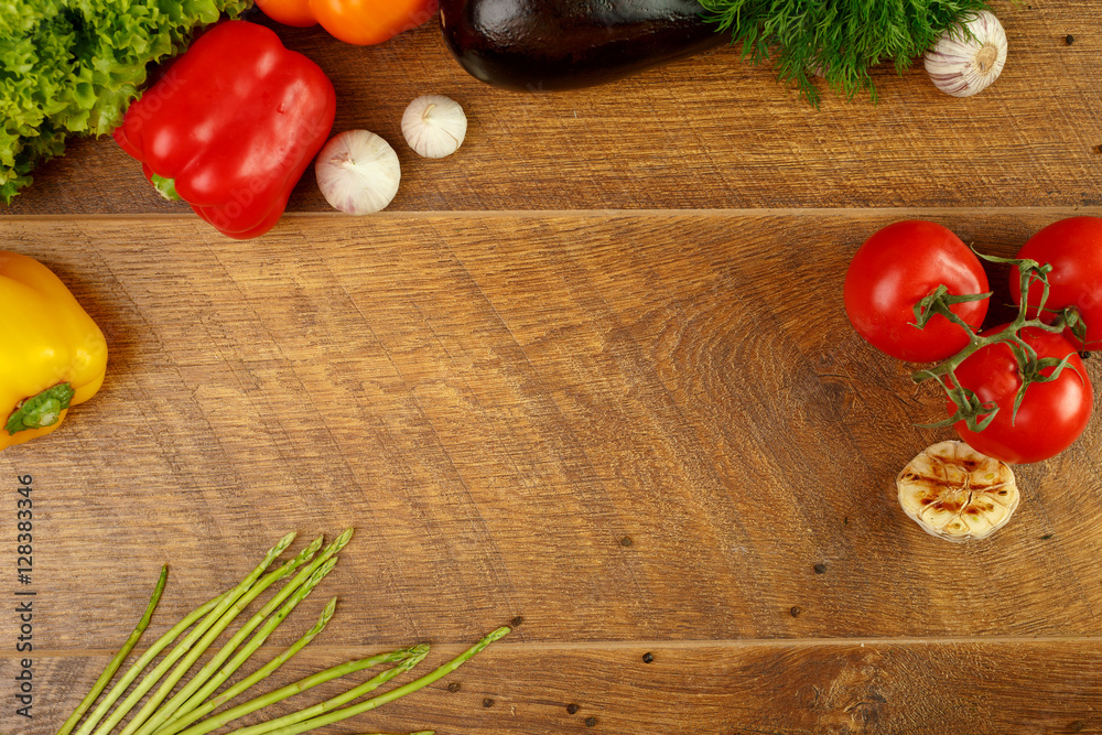 wooden background with vegetables and spices
wooden background with vegetables and spices