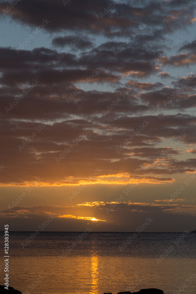 Sunset on the ocean coast. Sky Fiji