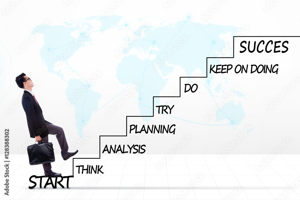 Male entrepreneur with strategy plan on stairs Male entrepreneur with strategy plan on stairs