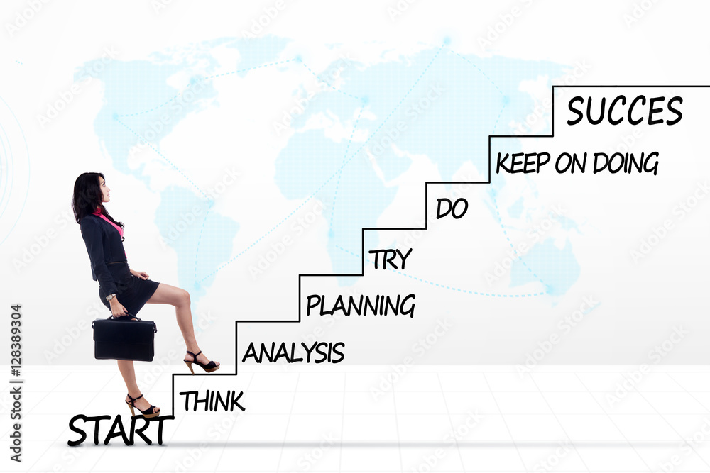 Young businesswoman with strategy plan on stairs Young businesswoman with strategy plan on stairs