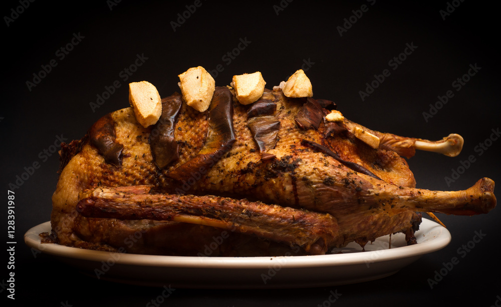 goose stuffed with apples and pumpkin baked to celebrate holidays