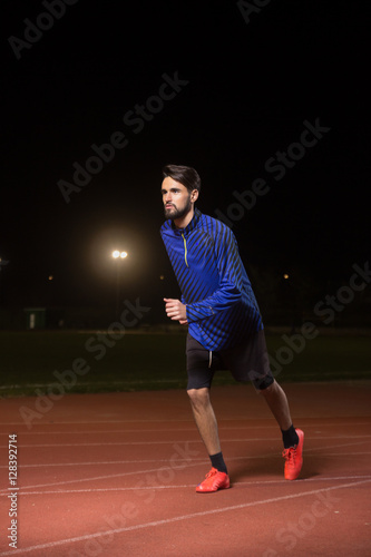 runner, running tracks dark night time.