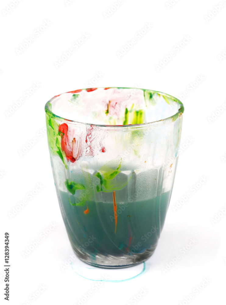 Glass smudged with paint and dirty water isolated on white Stock Photo