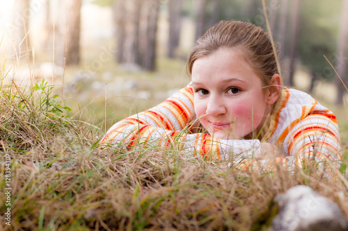 Young pretty girl enjoying in nature photo