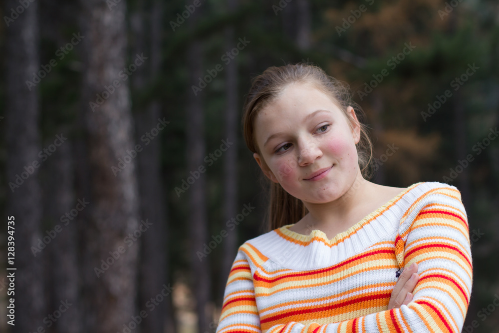 Little girl resting in forest
