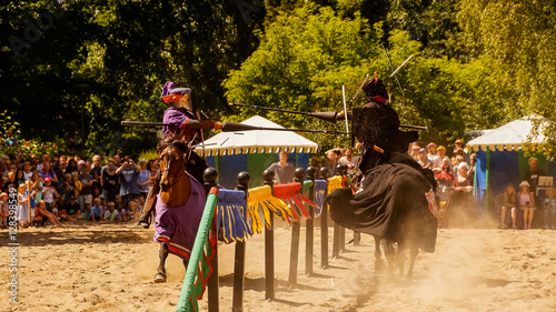 Knights jousting with lances photo