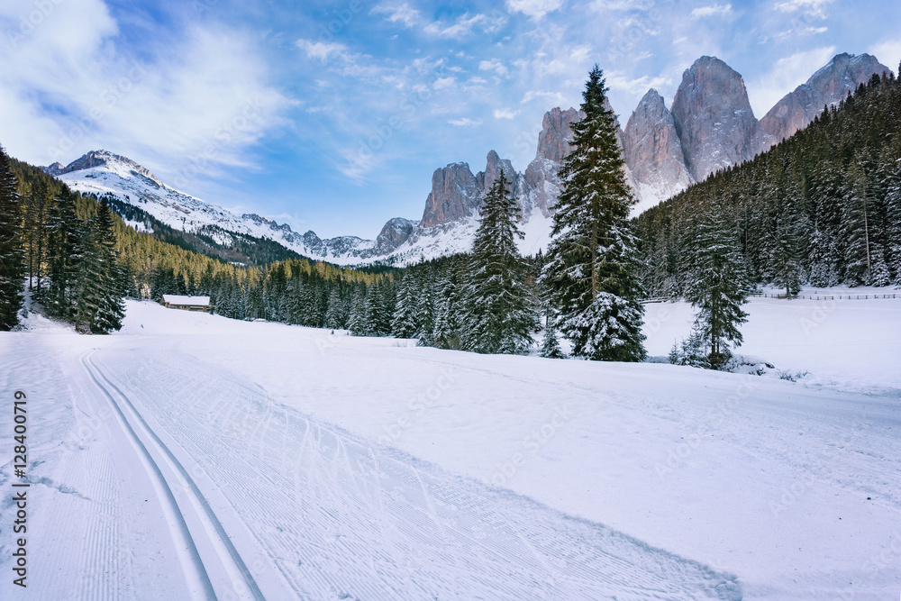 Winter views of the Geisler or Odle Dolomites mountain peaks in the Val di Funes (Villnosstal) in Italy. The surroundings of the village Santa Maddalena. Beautiful places for nordic ski.
