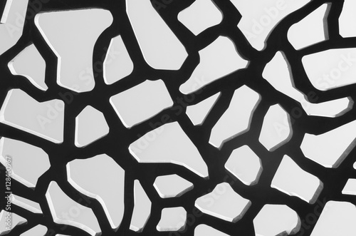 Perforated concrete on sky background abstract architectural pattern black and white