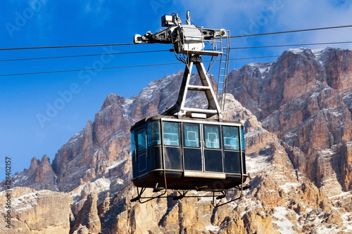 CORTINA D'AMPEZZO, DOLOMITES, The cable car on the background of rocks, Veneto, Italy. Winter view. photo