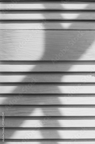 White wooden shutters interesting unusual abstract closeup texture with shadow