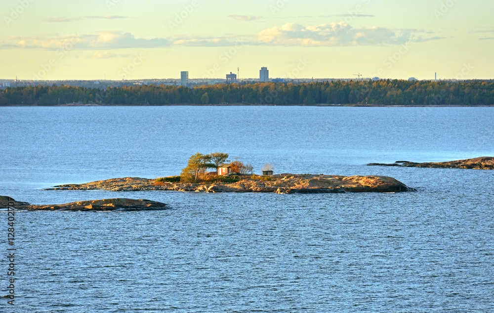 Naklejka premium Rocky islands in Helsinki archipelago on sunset